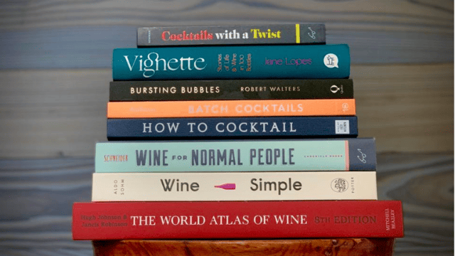 stack of forbes' favorite wine books